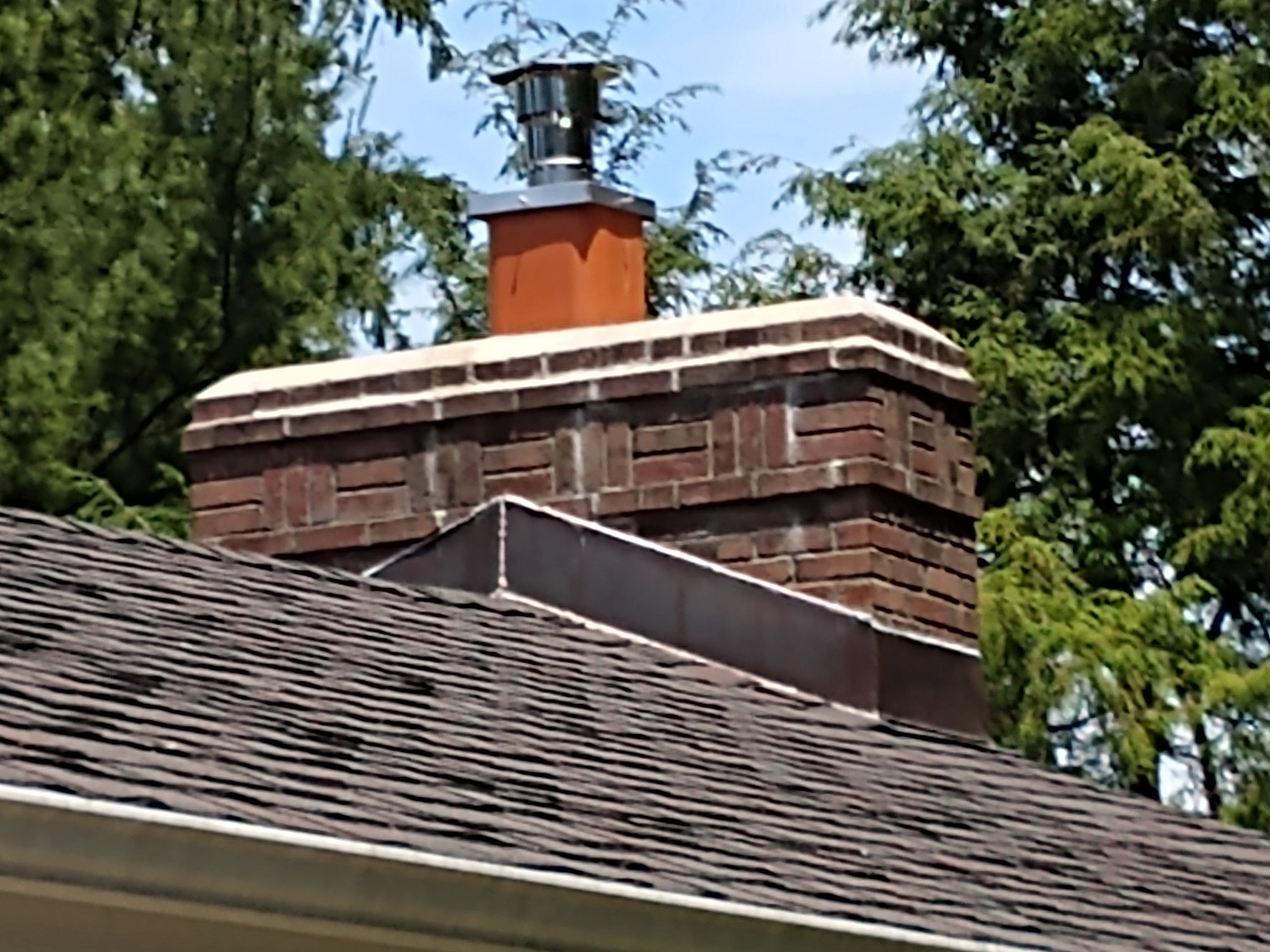 Stainless steel chimney cap with animal guard in Uniondale, New York